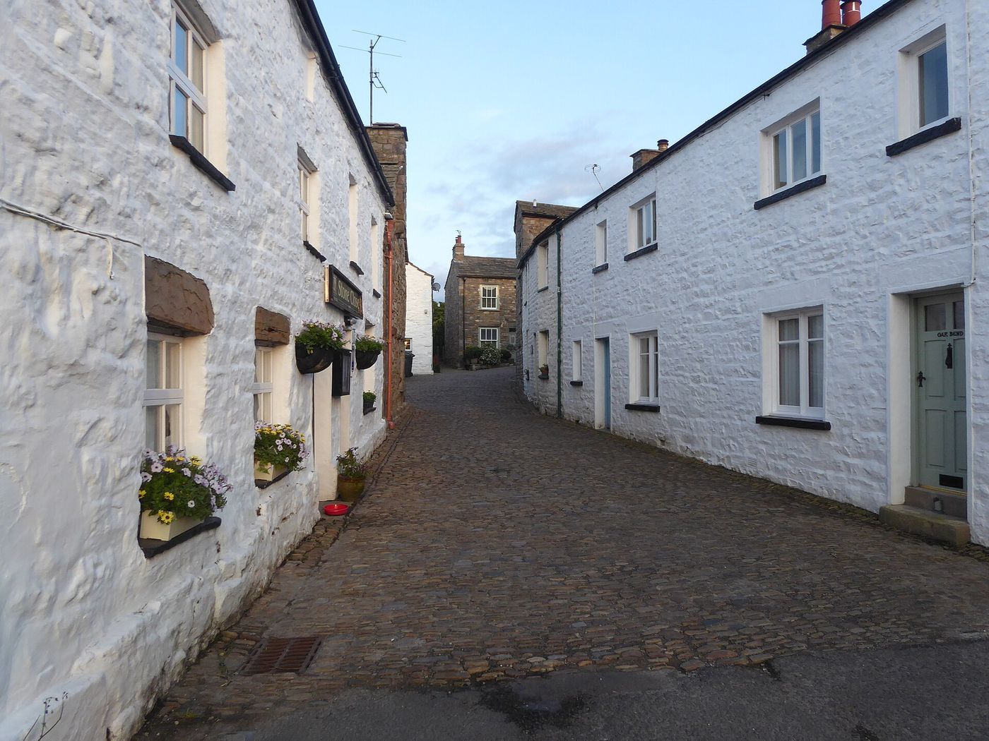 Whitewashed cottages along the cobbled Main Street in Dent