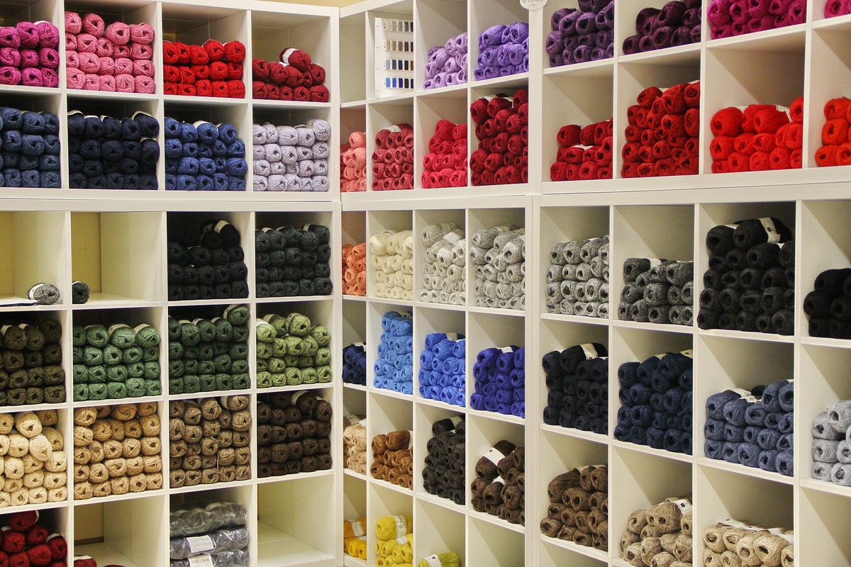 Shelves of knitting wool in many colours